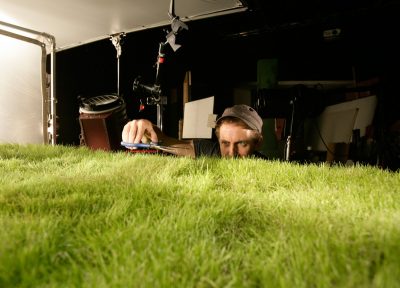 Director Simon Rippengale grooms the purpose-grown grass for the shoot.