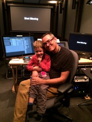 Alan Bell with his son in the cutting room.