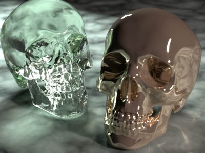  PxrVCM integrator's ability to resolve complex light paths, in particular the specular-diffuse-specular paths that arise from reflections or refractions of caustics. Note the caustics cast by the metal skull on the right onto the floor, and the complex refractions of caustics through the glass skull on the left. 