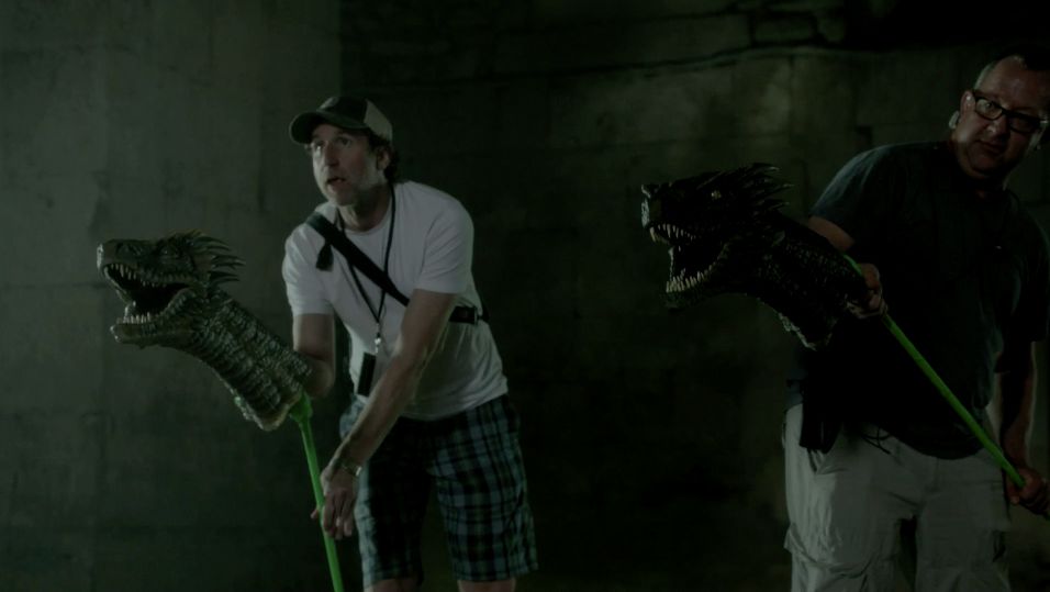 VFX producer Steve Kullback and VFX supervisor Joe Bauer hold the dragon heads.
