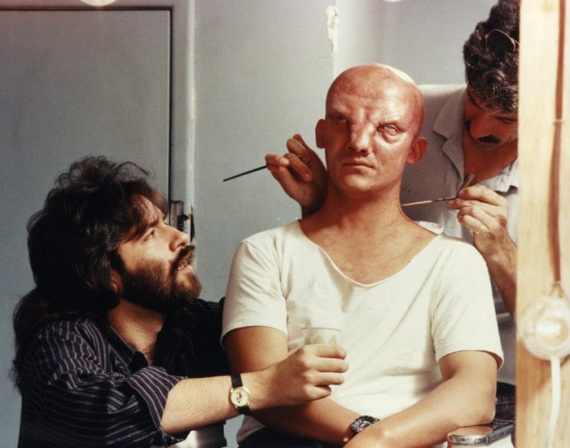 Left: Rob Bottin attends to some of the special effects make-up.