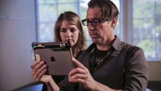 John Gaeta with the Ipad view incorporating the Structure Sensor which is scanning the room John is in.