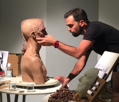 An attendee works on a Frankenstein bust in one of presenter Shane Mahan's (Legacy Effects) workshops at Trojan Horse.