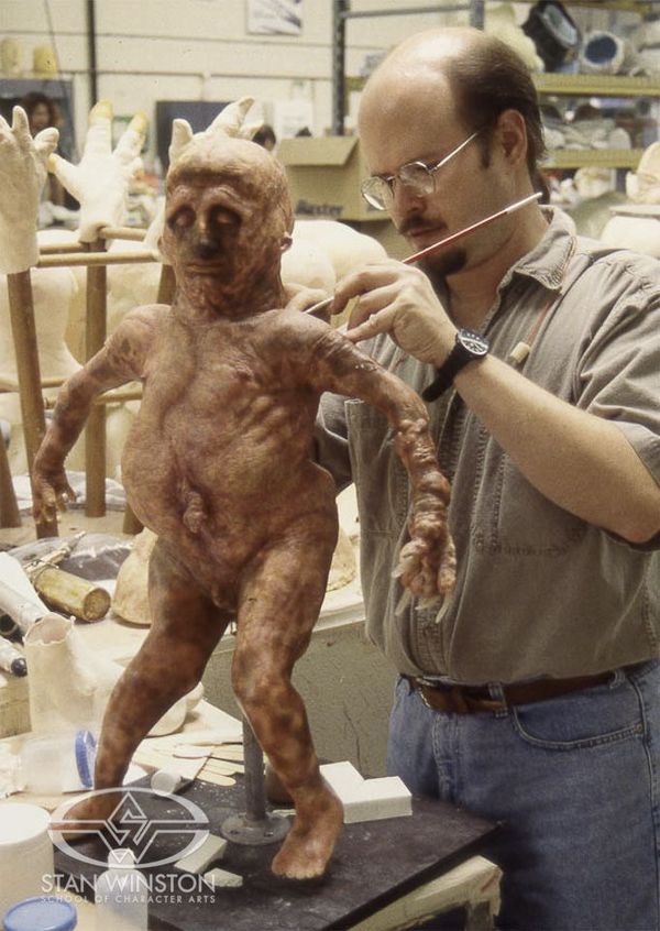Bruce Spaulding Fuller paints the diminutive "sloth boy" at Stan Winston Studio. Image via http://www.stanwinstonschool.com.