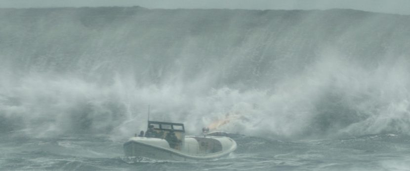The rescue boat battles to make it out to open waters.